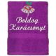 "Boldog karácsonyt" felirattal és haranggal hímzett törölköző, lila – karácsonyi hímzett törölköző