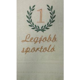 Krém hímzett „Legjobb sportoló” feliratú törölköző babérkoszorú mintával, sportolói ajándék